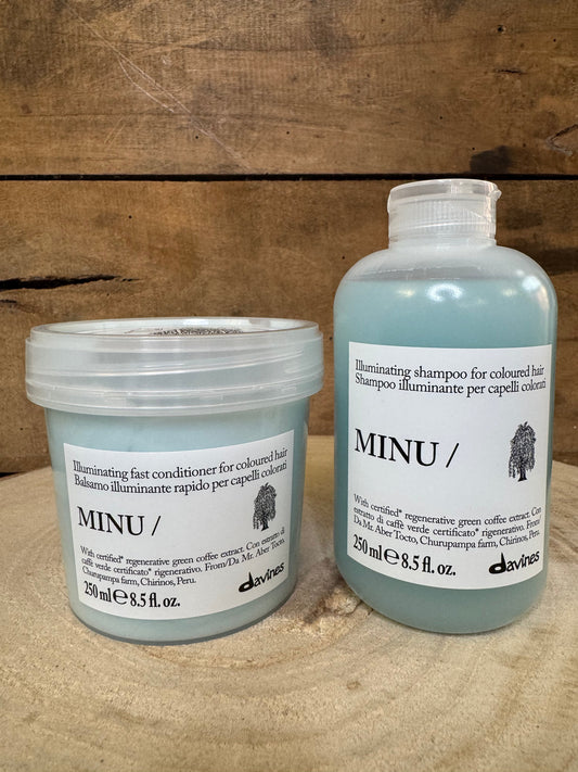Cristiano Suzzi Nuova Immagine MINU illuminating conditioner and shampoo for coloured hair in light blue bottles, with green coffee extract.